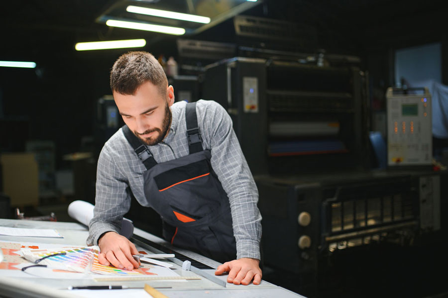 print operator checking colour swatches