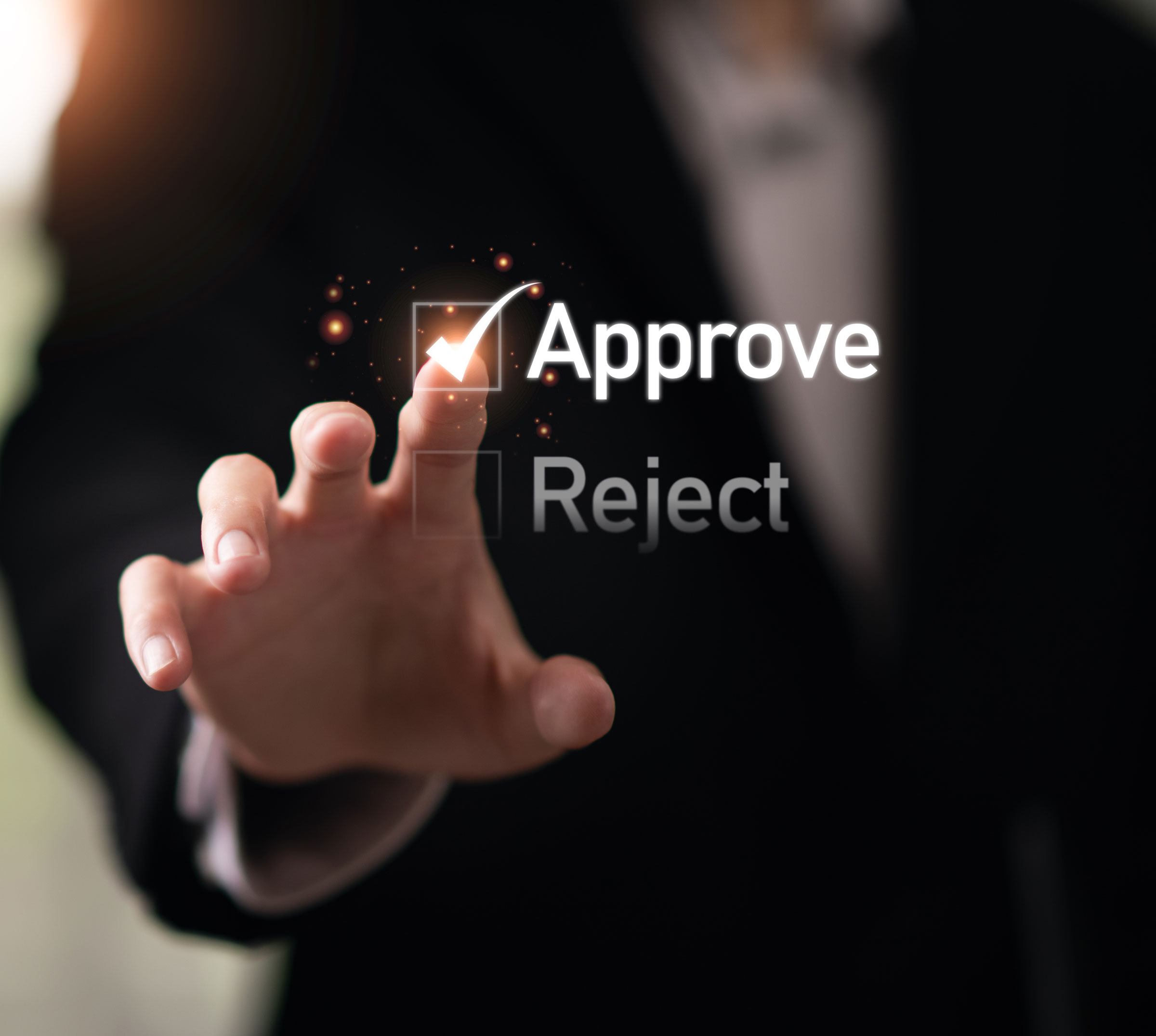 man clicking a button to approve